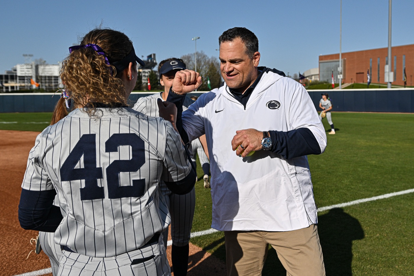 Dr. Patrick Kraft greeting a Penn State softball player