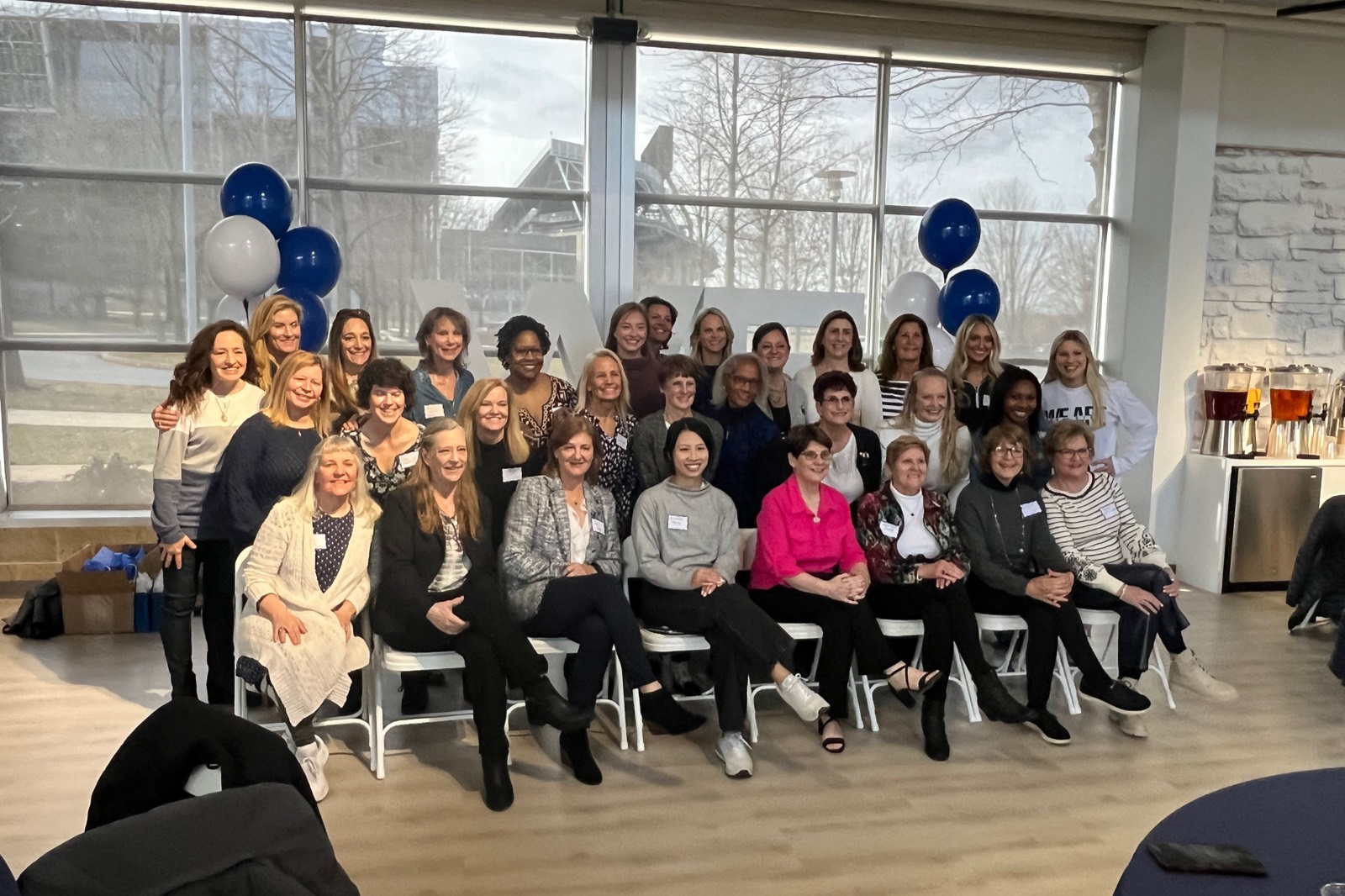 Penn State alumnae gathered for a group portrait at a Teammates For Life event