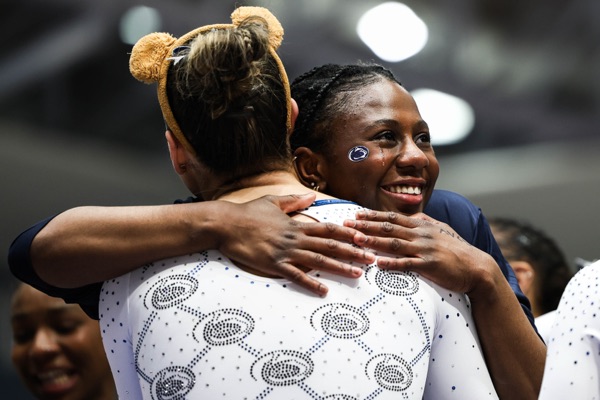 Saidat Omilabu embraces a teammate at the Big Four Meet