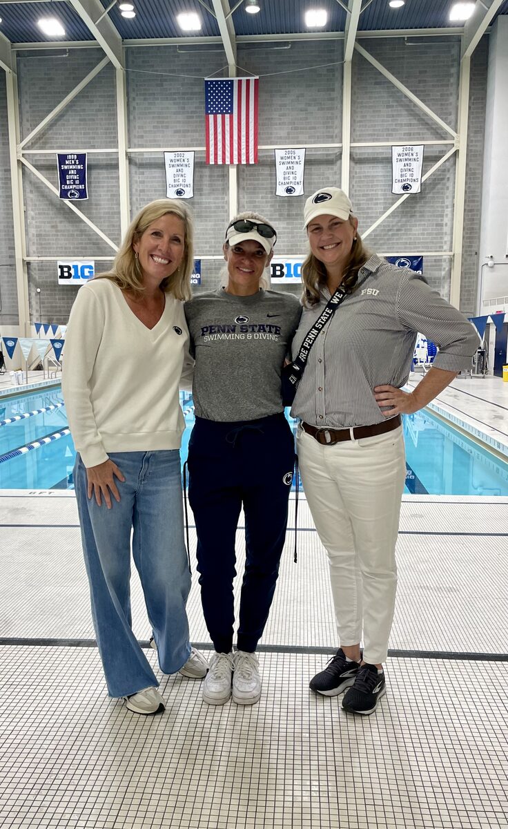 A Penn State Swimming and Diving coach with two Penn State alumnae at the natatorium