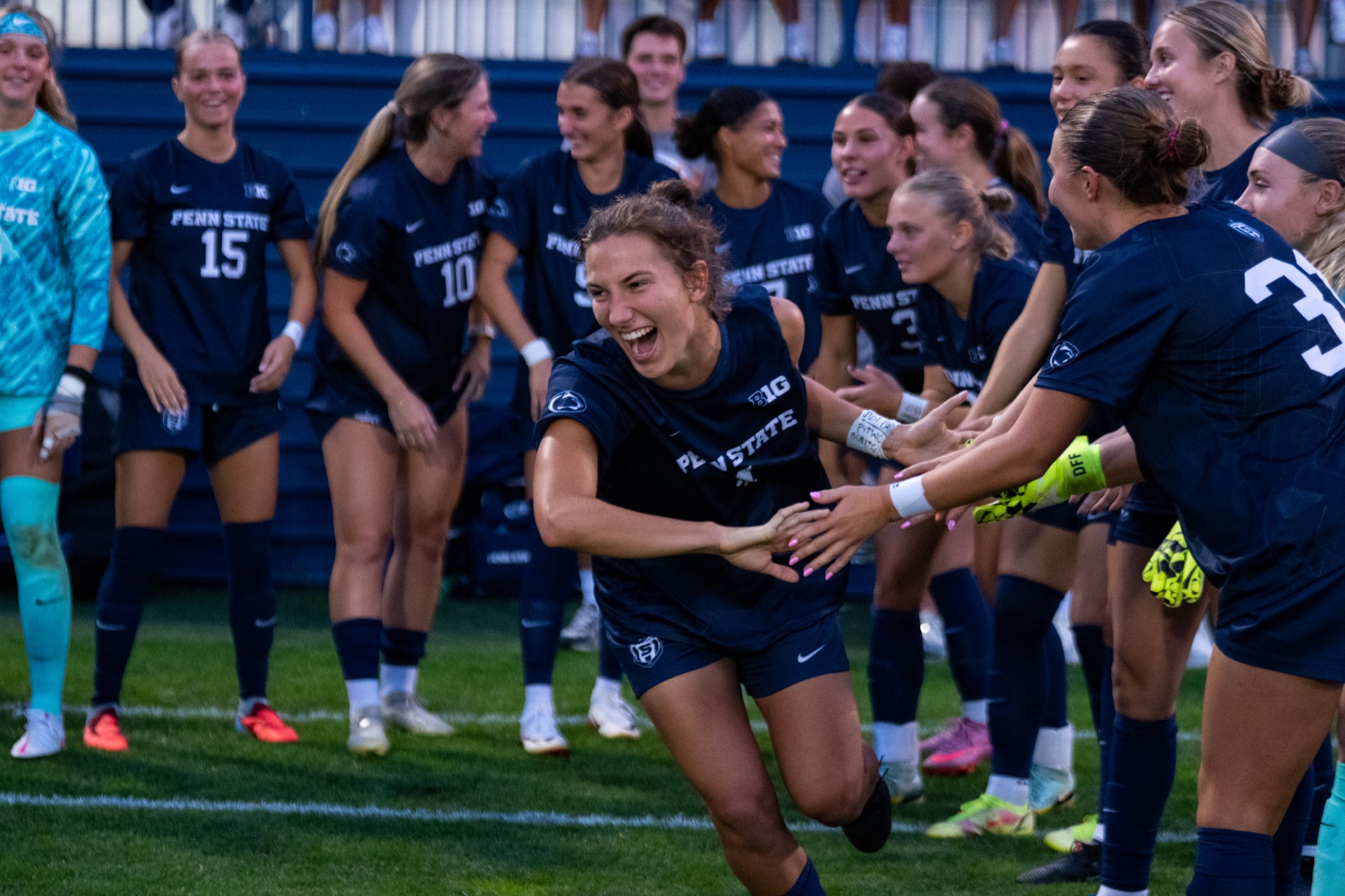 Penn State women's soccer team in a huddle
