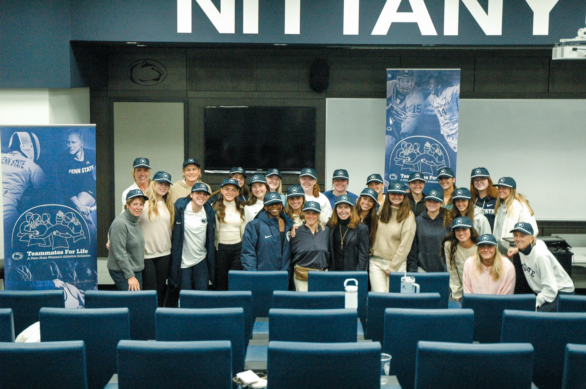 Penn State women athletes gathered in the locker room