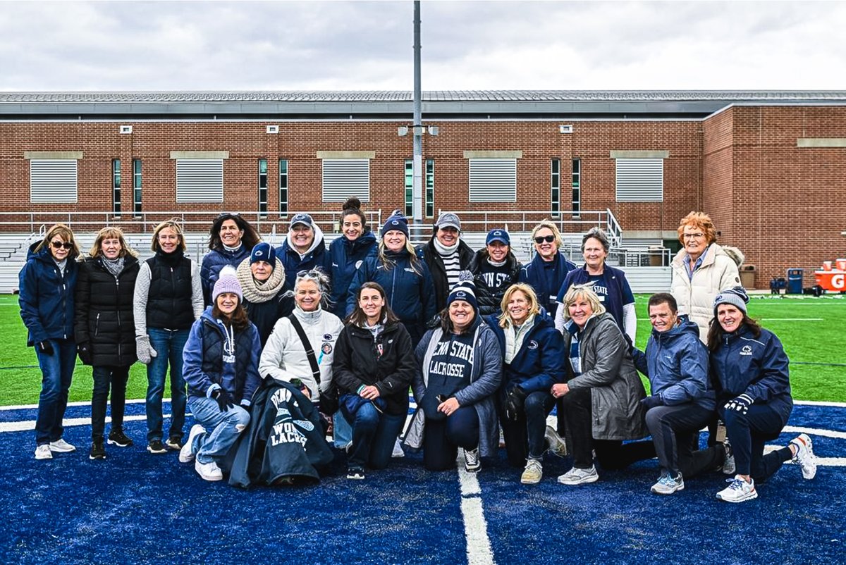Penn State alumnae athletes gathered on the field